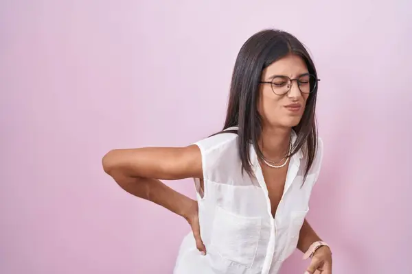 Brunette Young Woman Standing Pink Background Wearing Glasses Suffering Backache — Stock Photo, Image