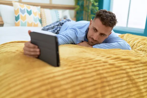 Young Hispanic Man Using Touchpad Lying Bed Bedroom — Stock Photo, Image