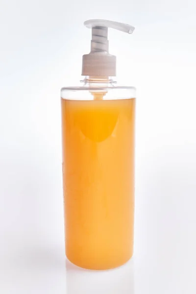 Translucent Orange Soap Dispenser White Background — Stock Photo, Image