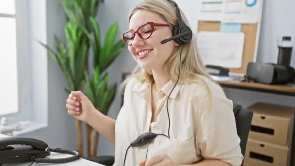 Cheerful Blonde Woman Wearing Headset Modern Office Expressing Positivity — Stock Video