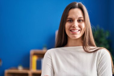 Young beautiful hispanic woman smiling confident standing at home