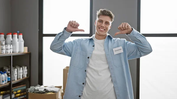 Young Confident Smiling Caucasian Man Volunteer Points Himself Charity Center — Stock Photo, Image