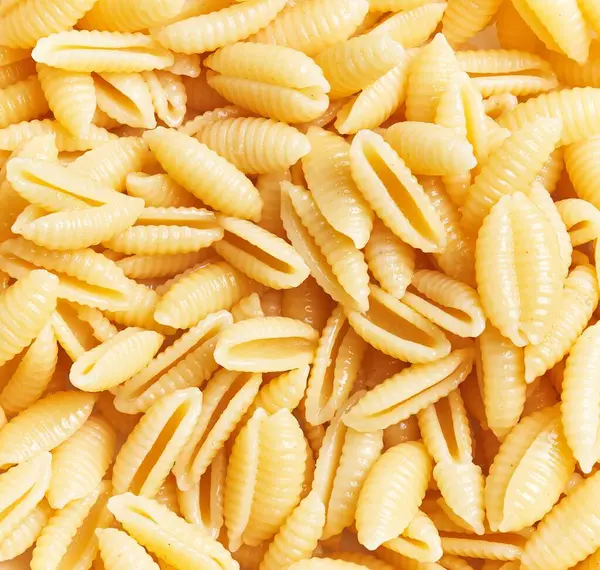 Close Uncooked Italian Fusilli Pasta Forming Textured Background Suitable Culinary — Stock Photo, Image