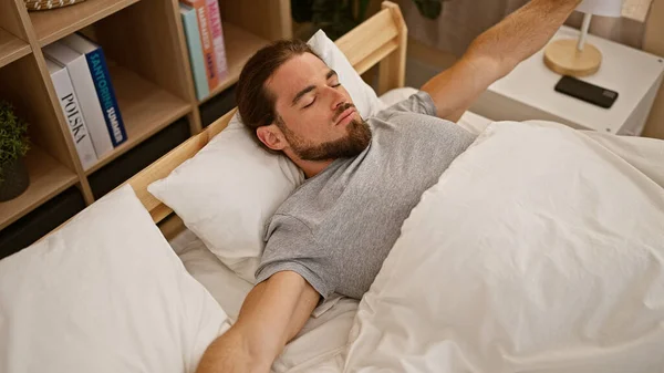 Young Hispanic Man Waking Stretching Arms Bedroom — Foto de Stock