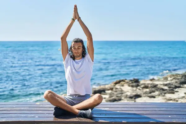 Young Hispanic Man Doing Yoga Exercise Sitting Bench Seaside — Stock Photo, Image