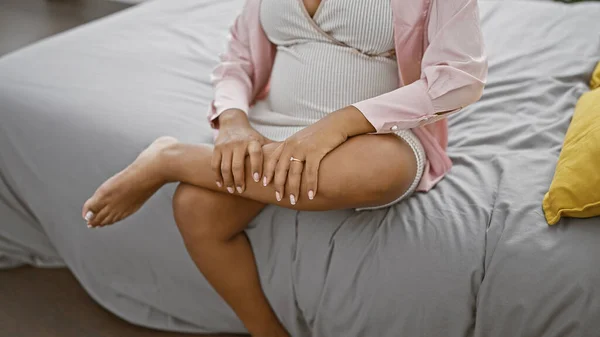 Exhausted Young Hispanic Woman Expecting Motherhood Sitting Bed Indoors Massaging — Stock Photo, Image
