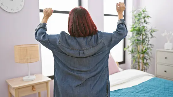 Mature Hispanic Woman Stretching Cozy Modern Bedroom Evoking Sense Morning — Stock Photo, Image