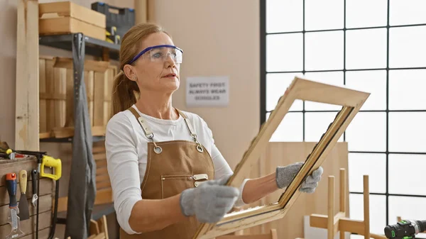 Mature Woman Examines Furniture Carpentry Workshop Surrounded Tools — Stock Photo, Image