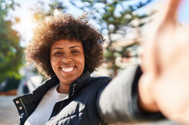 African american woman smiling confident making selfie by camera at park