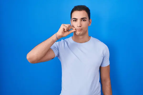 Young Hispanic Man Standing Blue Background Mouth Lips Shut Zip — Stock Photo, Image