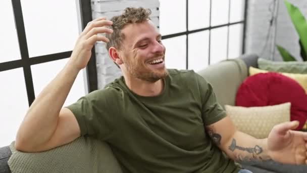 Smiling Young Man Tattoos Rests Couch Cozy Living Room Evoking — Stock Video