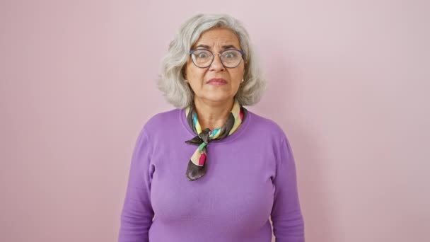 Worried Grey Haired Woman Glasses Nervously Pointing Aside Surprised Expression — Stock Video