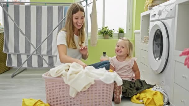 Happy Caucasian Mother Daughter Bonding Housework Sitting Together Laundry Room — Stock Video