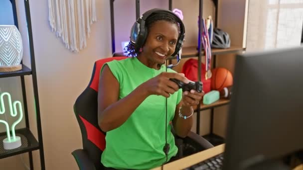 Smiling Woman Enjoys Gaming Cozy Room Neon Lights Computer Headset — Stock Video