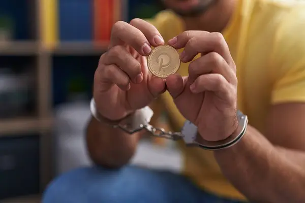 Young Hispanic Man Criminal Holding Polkadot Crypto Currency Wearing Handcuffs — Stock Photo, Image