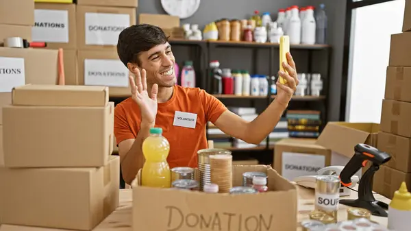 Hardworking Young Hispanic Man Volunteering Charity Center Enthusiastically Supports Community — Stock Photo, Image
