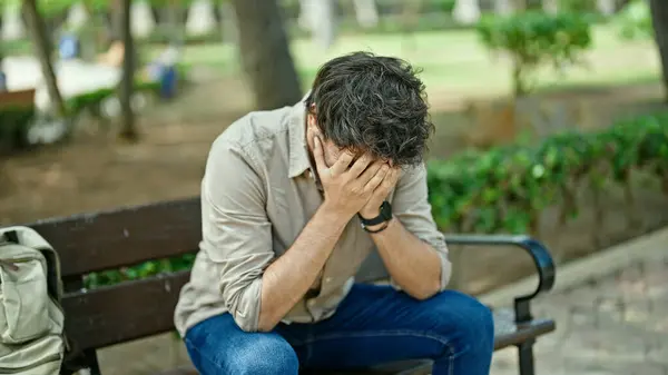 Young Hispanic Man Stressed Sitting Bench Park — Stock Photo, Image