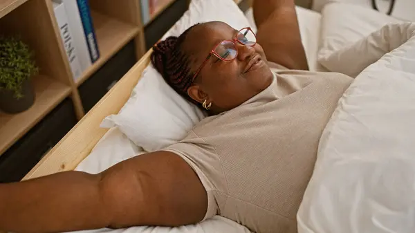 Happy Size African American Woman Stretching Arms Waking Comfortable Bed — Stock Photo, Image