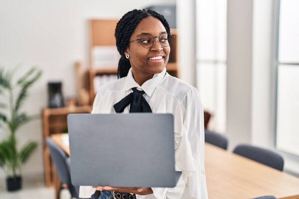 African american woman business worker using laptop working at office