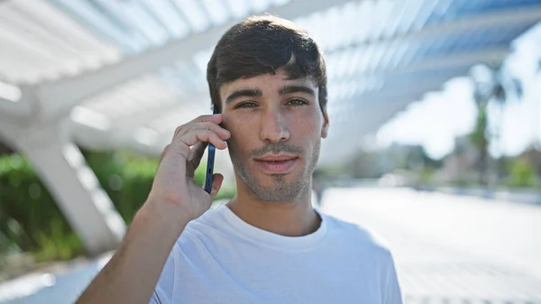 Cool Concentrate Young Hispanic Man Engaged Serious Conversation Smartphone Casually — Stock Photo, Image