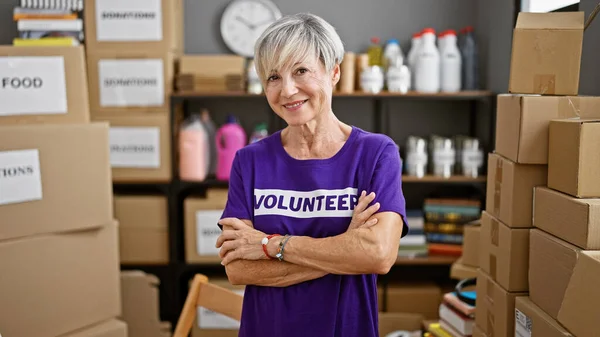 Mature Woman Volunteer Grey Hair Smiling Warehouse Surrounded Donation Boxes — Stock Photo, Image