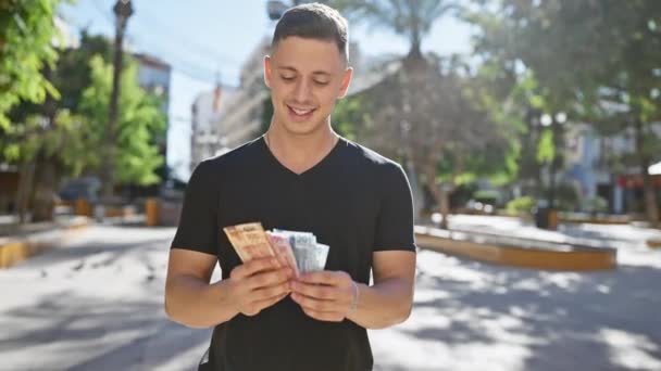 Handsome Man Counting Mexican Pesos Outdoors Sunny Park — Stock Video