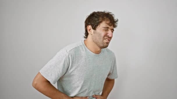 Young Man Grimacing Pain Clutching Stomach Due Illness Isolated White — Stock Video