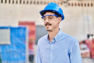 Young caucasian man architect smiling confident standing at street