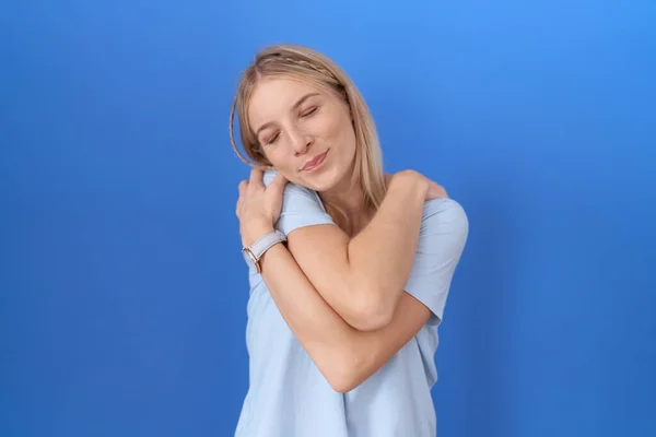 Young Caucasian Woman Wearing Casual Blue Shirt Hugging Oneself Happy — Stock Photo, Image