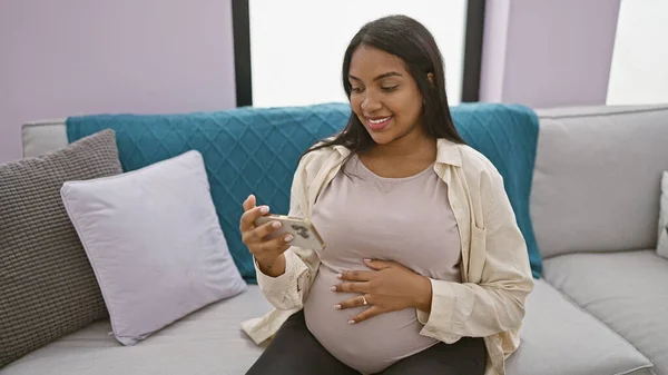 Joyous Young Pregnant Woman Relaxes Comfort Home Smiling While Watching — Stock Photo, Image