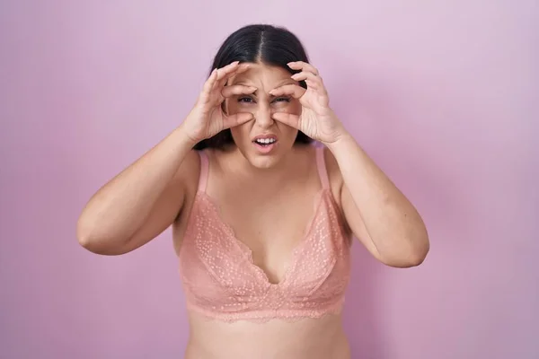 Young Hispanic Woman Wearing Pink Bra Trying Open Eyes Fingers — Stock Photo, Image