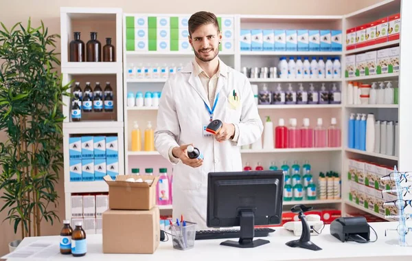 Young Caucasian Man Pharmacist Scanning Medication Bottle Pharmacy — Stock Photo, Image