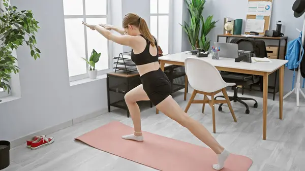 Woman Stretching Modern Office Space Implies Healthier Work Life Balance — Stock Photo, Image