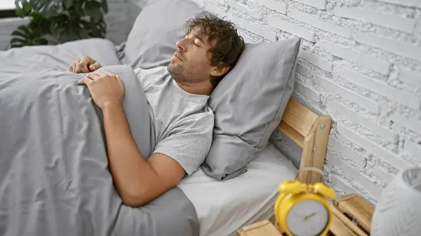 Hispanic Man Sleeping Peacefully Modern White Brick Bedroom Yellow Alarm — Stock Photo, Image
