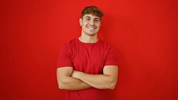 Cheery Young Hispanic Man Exuding Confidence Standing Tall Crossed Arms — Stock Photo, Image