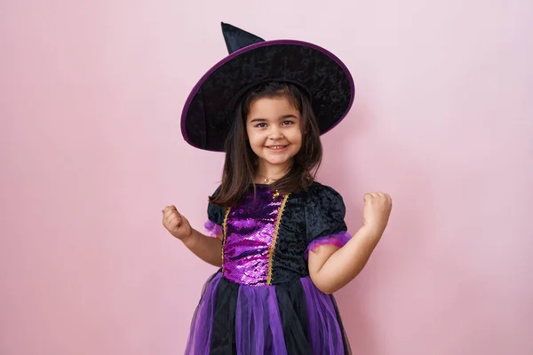 Excited Hispanic Girl Adorable Witch Costume Celebrates Victory Arms Raised — Stock Photo, Image