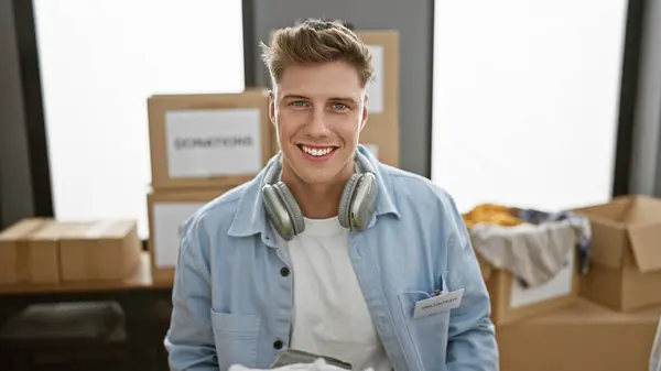 Handsome Young Caucasian Man Confidently Volunteering Charity Center Beaming While — Stock Photo, Image