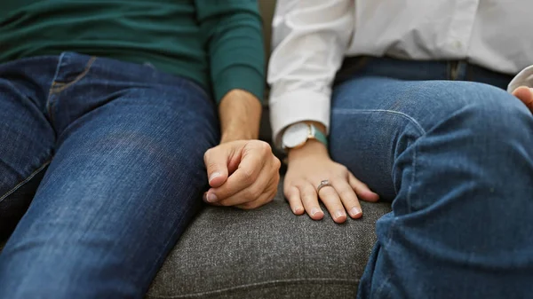 Man Woman Sit Closely Couch Hands Tenderly Clasped Symbolizing Love — Stock Photo, Image