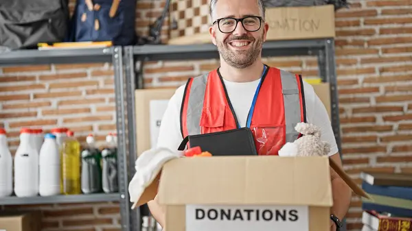 Grey Haired Man Volunteer Wearing Vest Holding Donations Package Charity — Stock Photo, Image