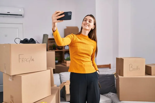 Young Caucasian Woman Smiling Confident Make Selfie Smartphone New Home — Stockfoto