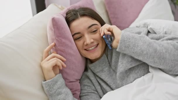Young Woman Chats Happily Smartphone While Relaxing Bed Cozy Well — Stock Video