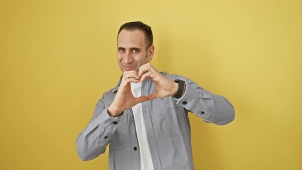 Cheerful Young Hispanic Man Wearing Shirt Expressing His Love Creating — Stock Video