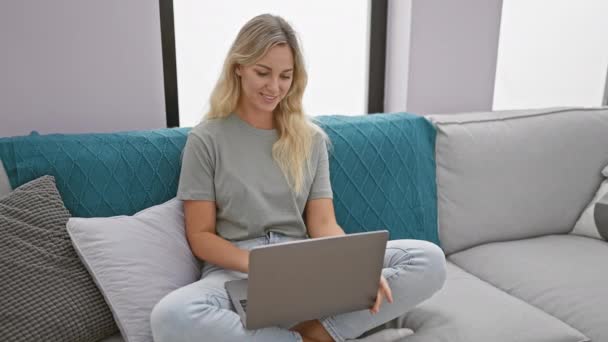 Young Woman Sitting Closed Laptop Sofa Modern Living Room — Stock Video