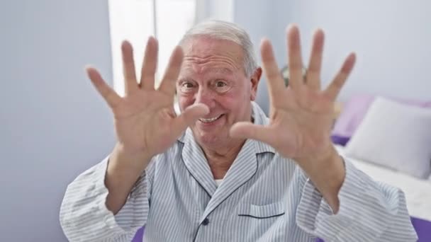 Cheerful Senior Man Sitting Bed Pyjama Happily Showing Pointing Number — Stock Video