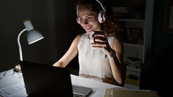 Young Woman Enjoys Coffee Late Night Video Call Home Office — Stock Video