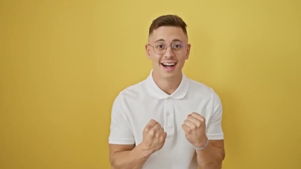 Cheering Young Hispanic Man Glasses Celebrates His Victory Screaming Raised — Stock Video