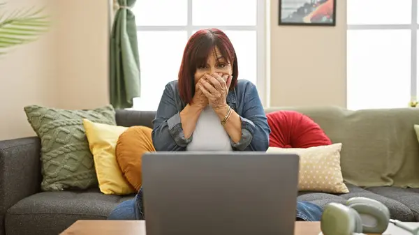 Shocked Middle Aged Woman Covering Mouth While Using Laptop Cozy — Stock Photo, Image