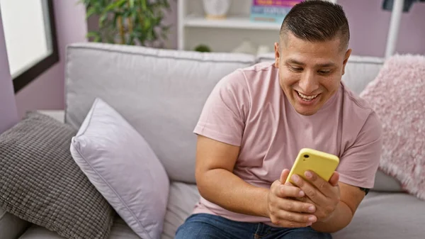 Cheerful Young Latin Man Enjoying His Time Home Sitting Sofa — Stock Photo, Image