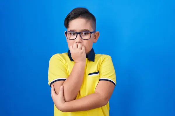Young Hispanic Kid Standing Blue Background Looking Stressed Nervous Hands — Zdjęcie stockowe