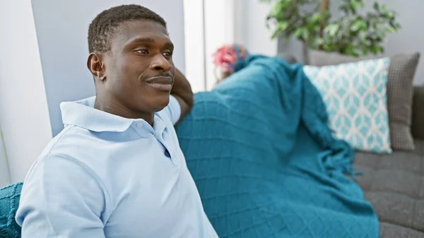 African American Man Relaxes Living Room Exuding Comfort Serenity Amidst — Stock Photo, Image